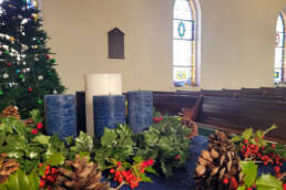 candles and christmas time in the zion arendtsville ucc sanctuary