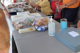 people working at a zion ucc bakesale table